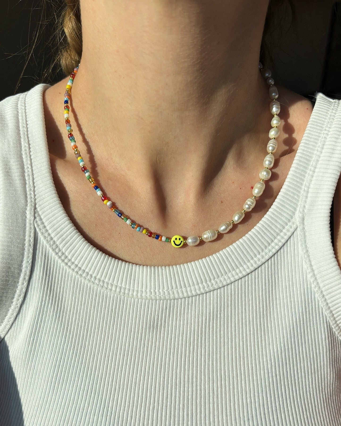 Smiley face pearl necklace with glass beads