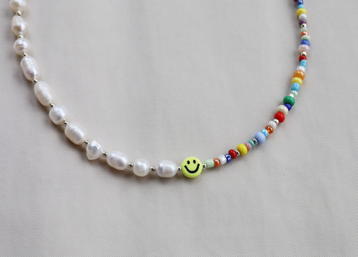 Smiley face pearl necklace with glass beads